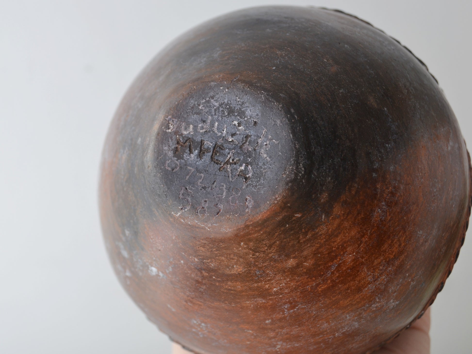 
Base of Zulu ukhamba showing artist signature Mfeka and contact number, KwaZulu-Natal South Africa